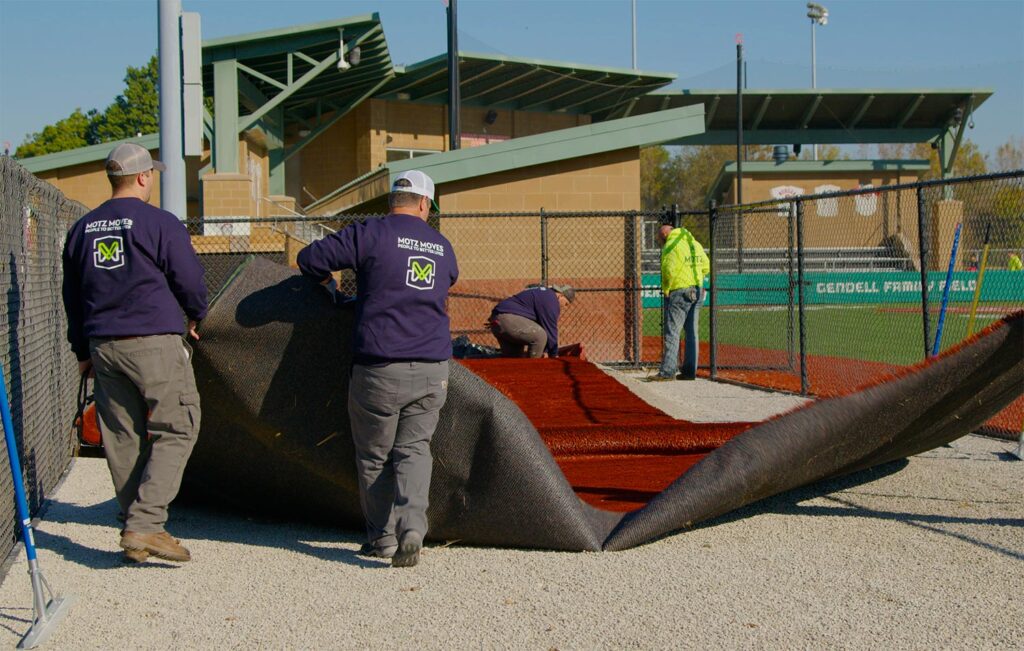 workers installing field turf